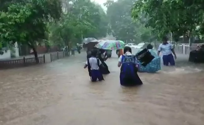 Heavy overnight showers flood Mumbai, several trains cancelled - Sakshi