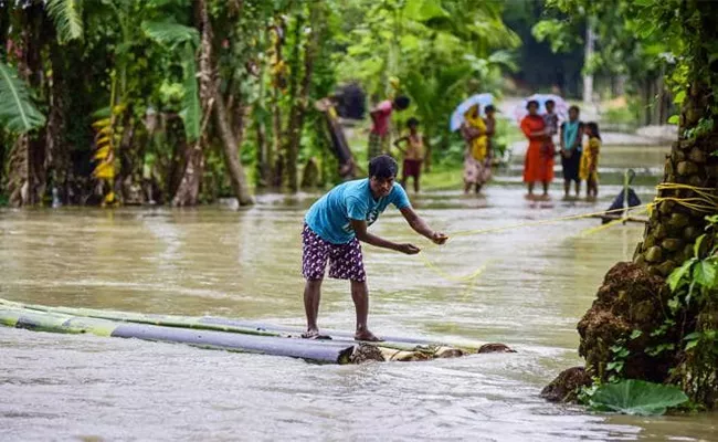 Heavy  Rain Fall In Assam - Sakshi