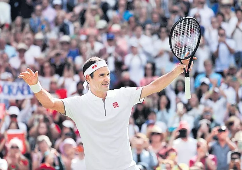 Roger Federer survives Wimbledon scare from Lloyd Harris to reach second-round - Sakshi