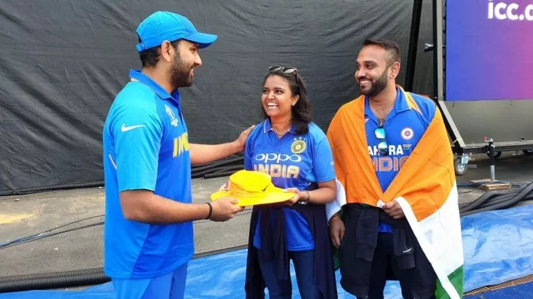 Hit by a six, fan gets signed hat from Rohit Sharma - Sakshi