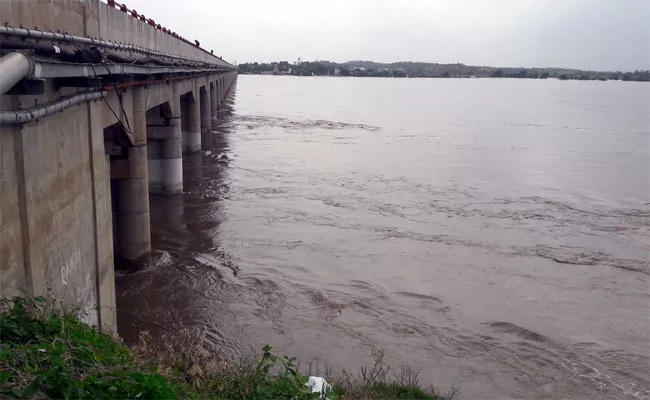 Heavy Water Flow In Krishna River Wanaparthy - Sakshi