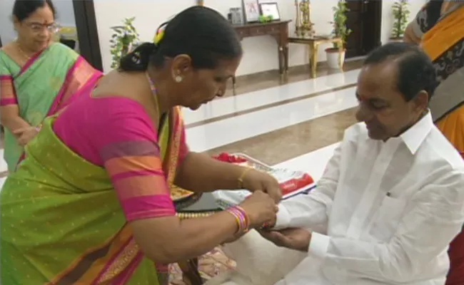 Women tied rakhi to Telangana Chief Minister KCR at Pragati bhavan - Sakshi