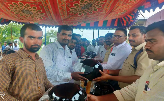 Person Distributed Helmets In Bhainsa For Road Accidents Safety Awareness  - Sakshi