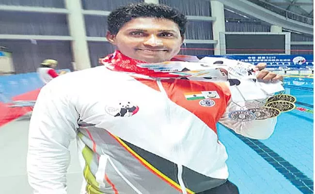 Swimmer Tulasi Chaitanya Won Six Medals In China - Sakshi