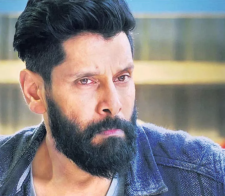 vikram another experiment with 25 getups - Sakshi