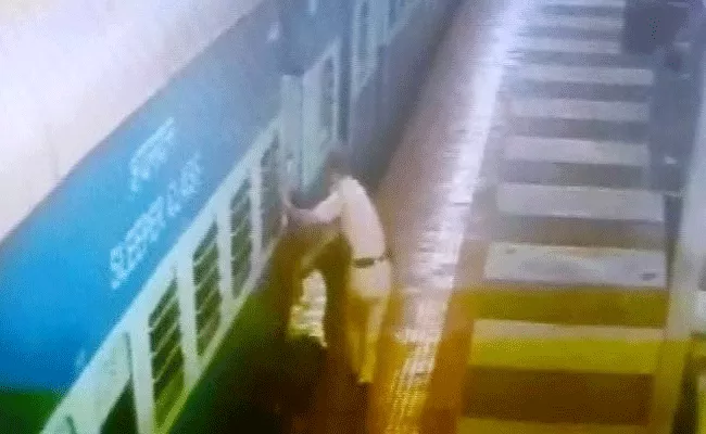 Railway Cop Saves Man Who Slipped Between Train And Platform In Hyderabad - Sakshi