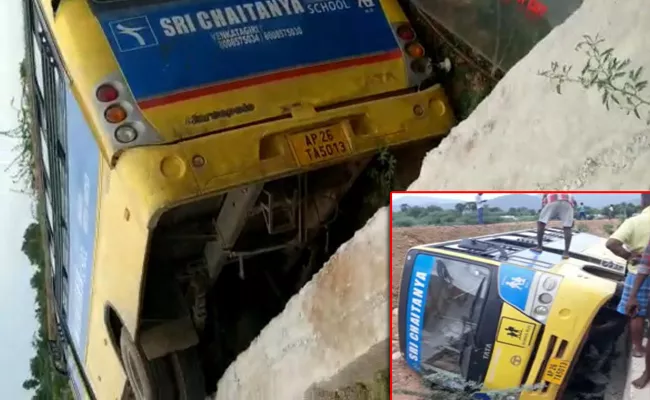 Students injured as school bus falls off culvert In Nellore district - Sakshi