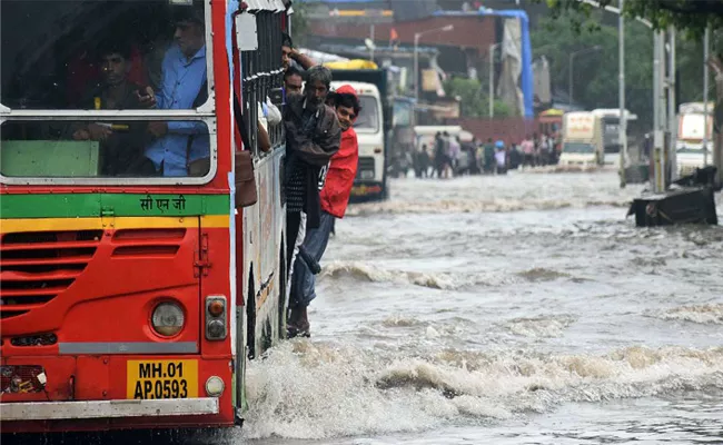 Mumbai rains, All local trains operational, schools, colleges shut - Sakshi