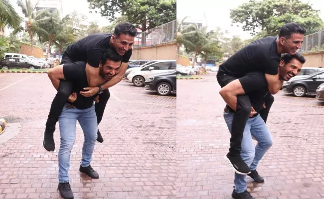 Akshay Kumar Gets Piggyback Ride On John Abraham - Sakshi