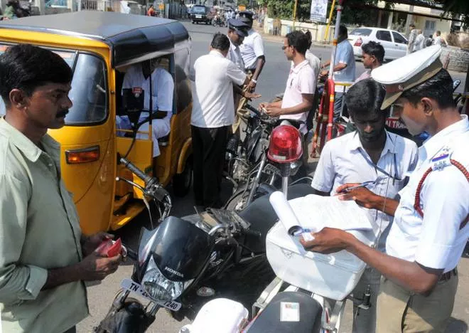 Vijay Rupani Reduces Traffic Violation Fines Under New Motor Vehicles Act - Sakshi