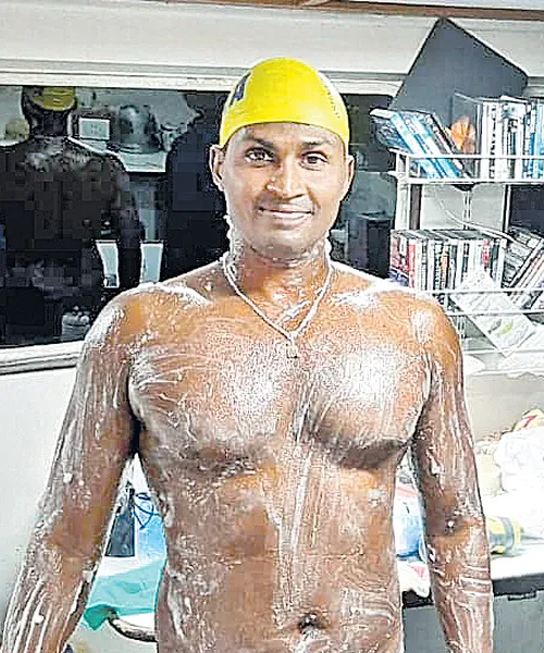 AP Swimmer Tulasi Chaitanya Gets Rare Feat - Sakshi