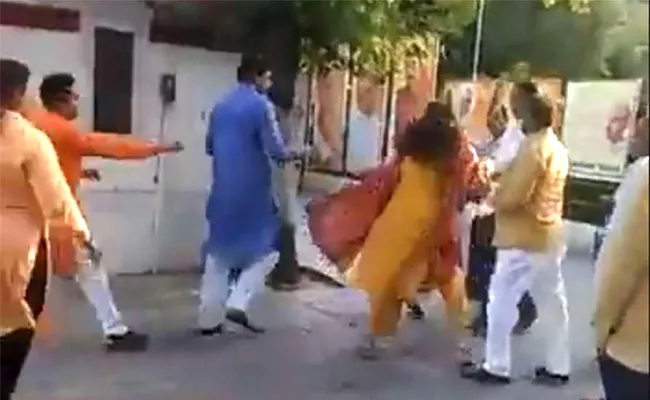 Delhi BJP Leader Seen Slapping Ex Mayor - Sakshi