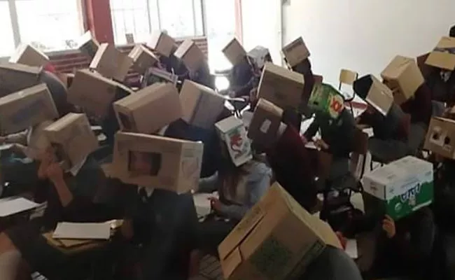 Mexican Teacher Putting Cardboard Boxes On Students Heads To Stop Cheating In Exams - Sakshi