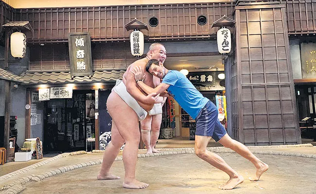 Novak Djokovic Tries Sumo Wrestling At Tokyo - Sakshi