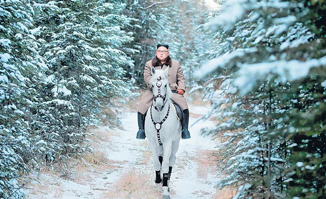 Kim Jong Un rides white horse up sacred mountain - Sakshi