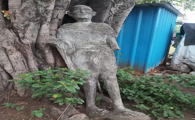 Believing In Superstitions Nawabpet Villagers Left Gandhi Statue Under A Tree - Sakshi