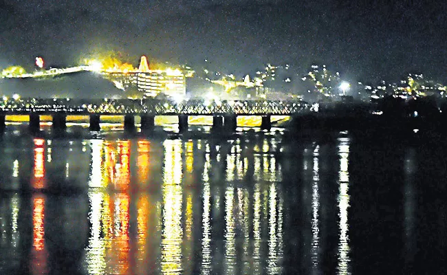 Vijayawada In The Night With lighting Effects along Krishna River - Sakshi