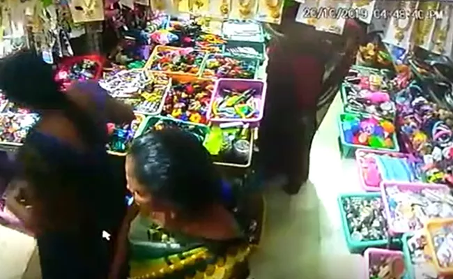 Women Stealing Things In Store Caught On CCTV - Sakshi