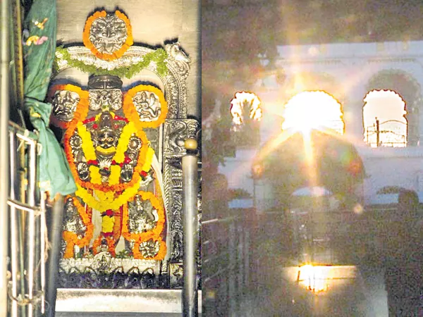 Devotees on Wednesday witnessed the spectacle of the first sun rays hit to Lord Suryanarayana  - Sakshi