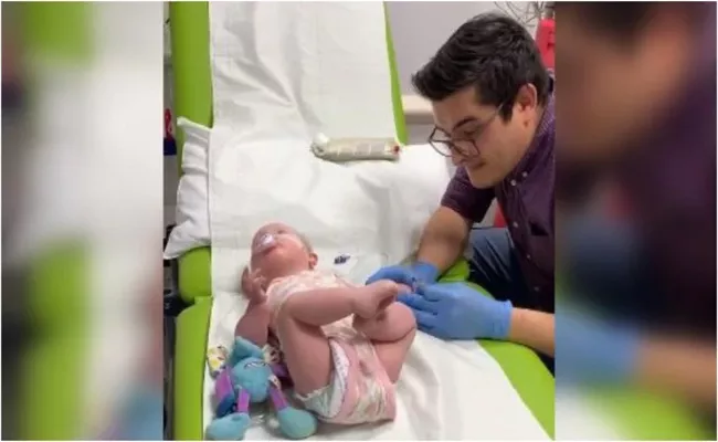 Doctor Sings Nat King Cole Unforgettable Song For Baby To Pacify Her During Blood Test - Sakshi