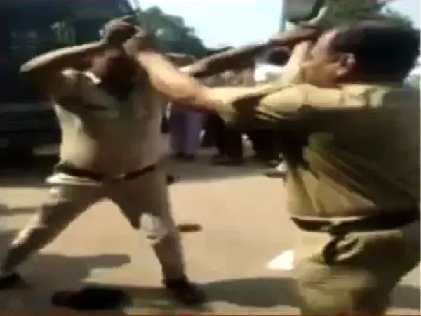 Cops Beating Hurling Shoes Each Other At Maharashtras Bhandara - Sakshi