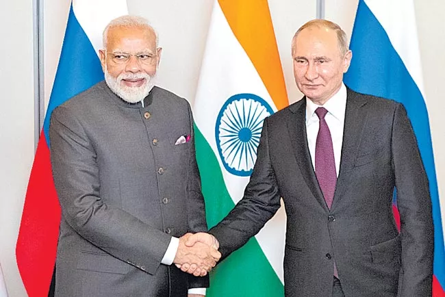 PM Modi Meets Russian President Vladimir Putin in Brazil - Sakshi