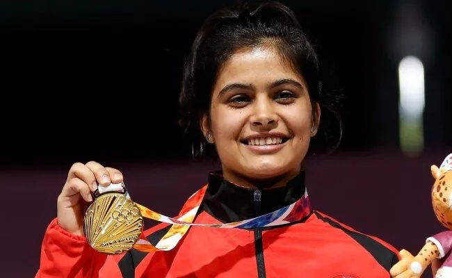 Manu Bhaker Bags Gold And Breaks Junior World Record - Sakshi