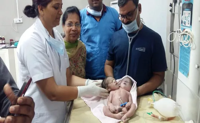 Woman Gives Birth To Boy With 2 Heads And 3 Hands - Sakshi