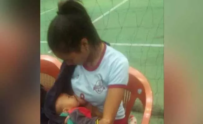 Mizoram Volleyball Player Breastfeeds 7 Months Child In Break Wins Internet - Sakshi