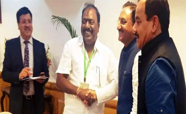 Tirupati MP Balli Durga Prasad Meet HRD Minister - Sakshi