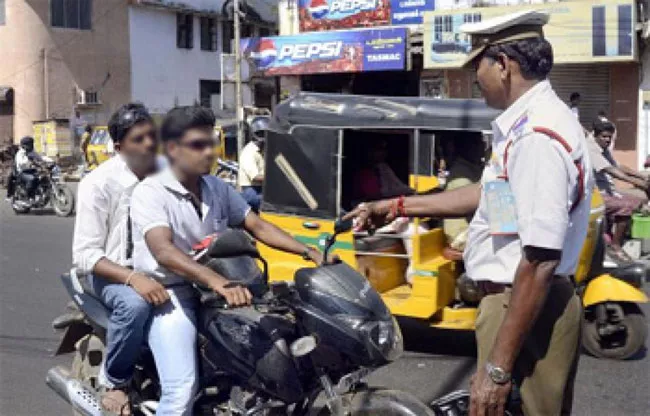 Vijayawada: Licence Cancel if not Wearing Helmets - Sakshi