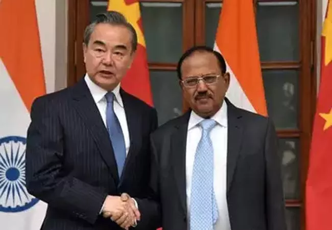 Ajit Doval, Chinese Foreign Minister hold boundary talks in Delhi - Sakshi