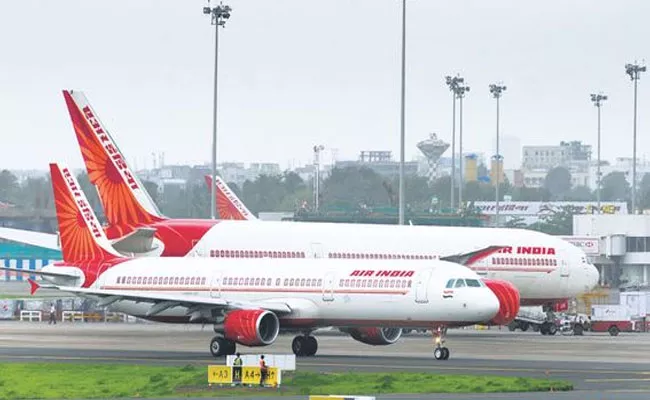 Pay dues immediately, allows us to quit without notice period Air India pilots - Sakshi