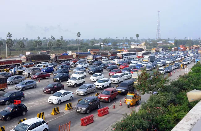 Sankranti Festival: Traffic Jam At Toll Gates - Sakshi