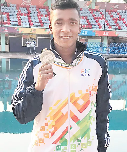 AP Swimmer Lohit Wins Silver Medal In Indian Youth Games - Sakshi