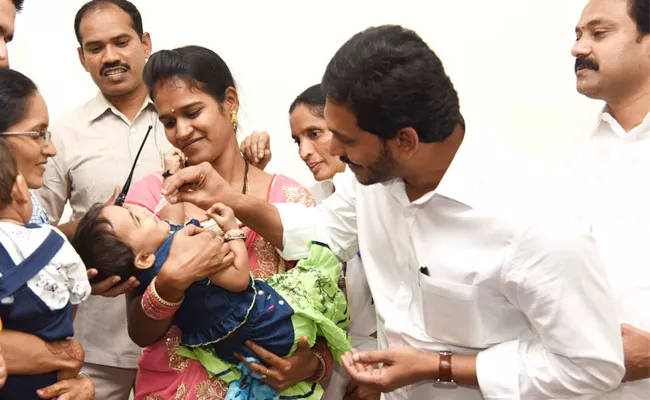 CM YS Jagan Gives Polio Drops To A Child In Camp Office - Sakshi