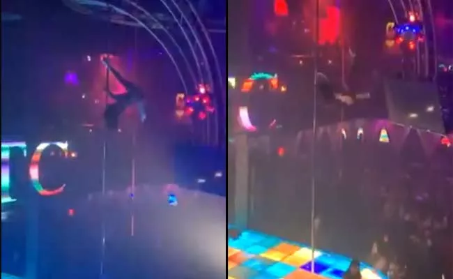 Stripper Falls From15 Foot Pole But Continues Dancing Became Viral - Sakshi