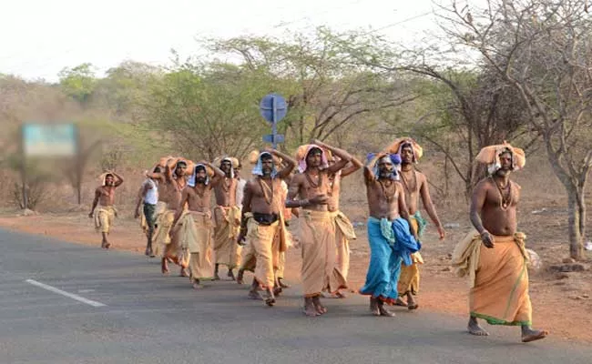 Devotee Going To Mallikarjuna Swamy Temple By Walk From Achampet - Sakshi