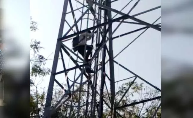 Man Climb Cell Tower And Protest In Khammam - Sakshi