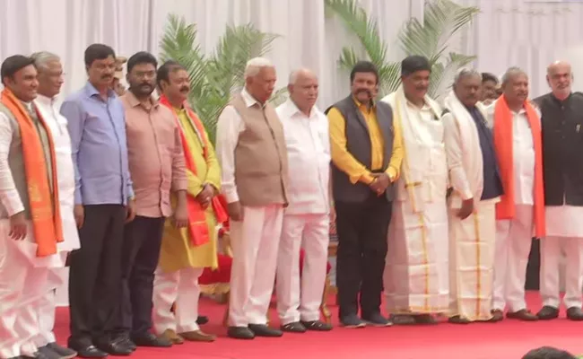 karnataka cabinet Expansion : turncoat MLAs Take Oath as Ministers  - Sakshi