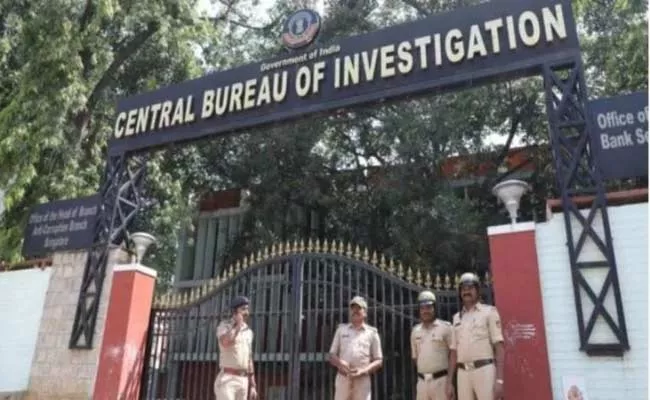 CBI Officers Arrest Deputy CM Manish Sisodia OSD Gopal Krishna Madhav - Sakshi