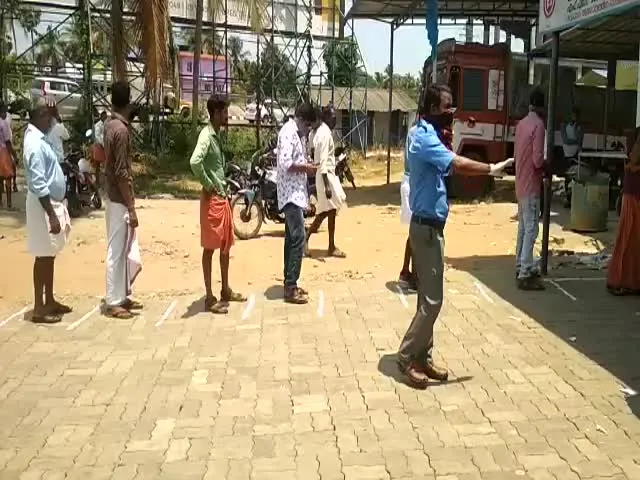 People Keep Distance In Queue To Buy Liquor