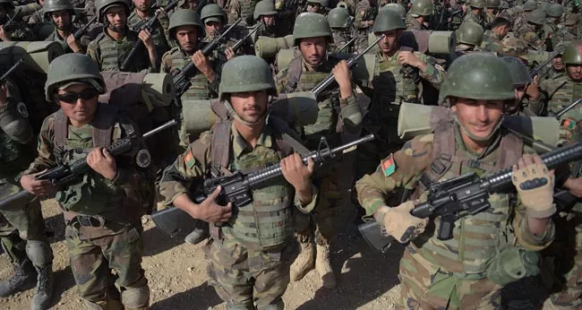 Dozens of Afghan troops Lifeloss in insider attack - Sakshi