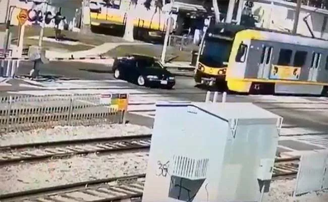 Train Collides Into Car Crossing Railway Track Became Viral - Sakshi