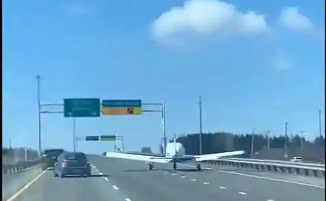 Watch Video How Plane Lands In Busy Highway In Canada - Sakshi