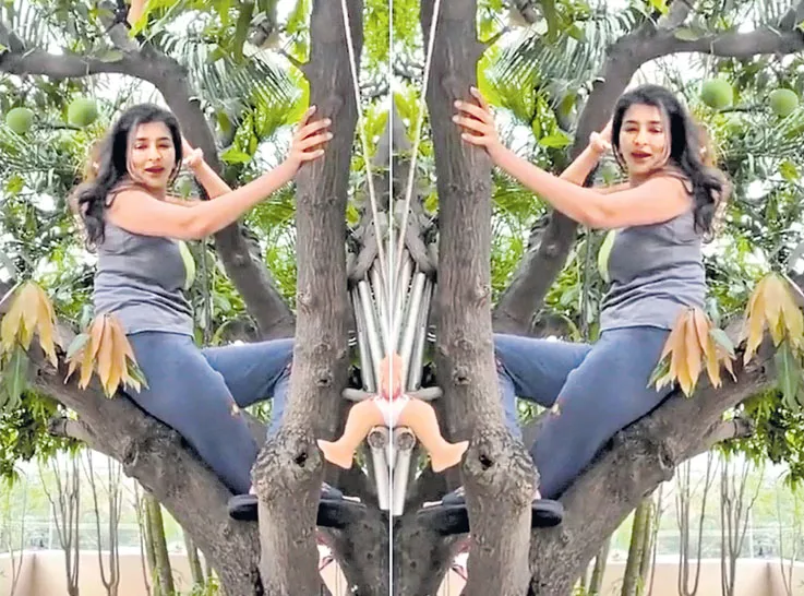 Manchu Lakshmi climbs Mango tree for her daughter Nirvana - Sakshi