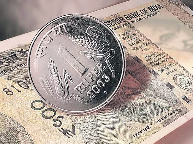 Rupee surges 52 paise to close at four-week high of 75 - Sakshi