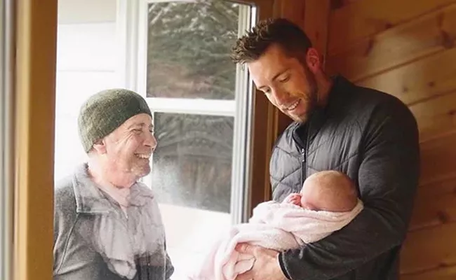 Grandfather Meets Newborn Granddaughter Through Window In Michigan - Sakshi