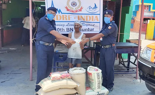 NDRF React on Sathyam Mound bread And Donate Rice And Urad - Sakshi