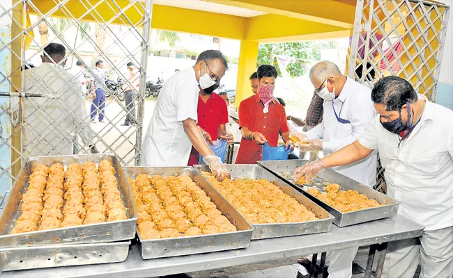 Huge response to Srivari Laddu Prasadam in first day sale - Sakshi